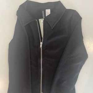 black sweater with zipper on both ends.